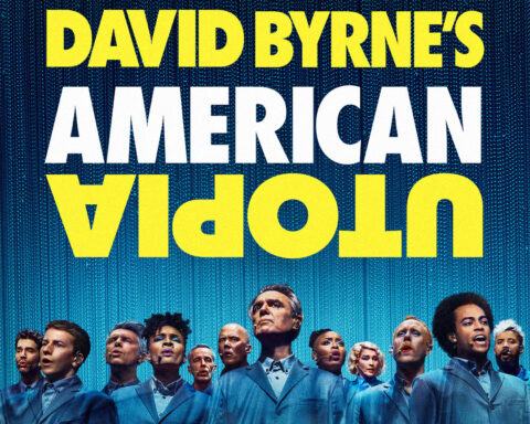Cartaz do espetáculo American Utopia de David Byrne com elenco em palco.